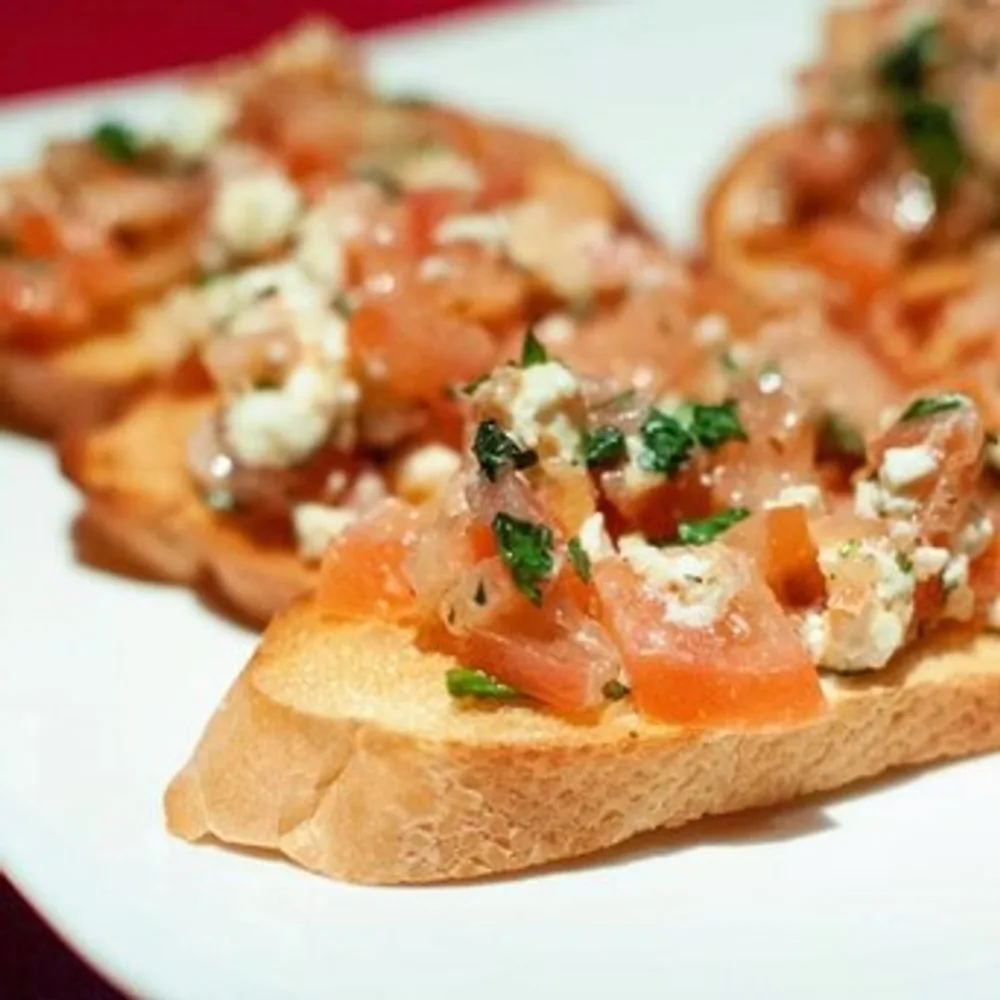 Bruschetta with fresh tomatoes, herbs and cheese