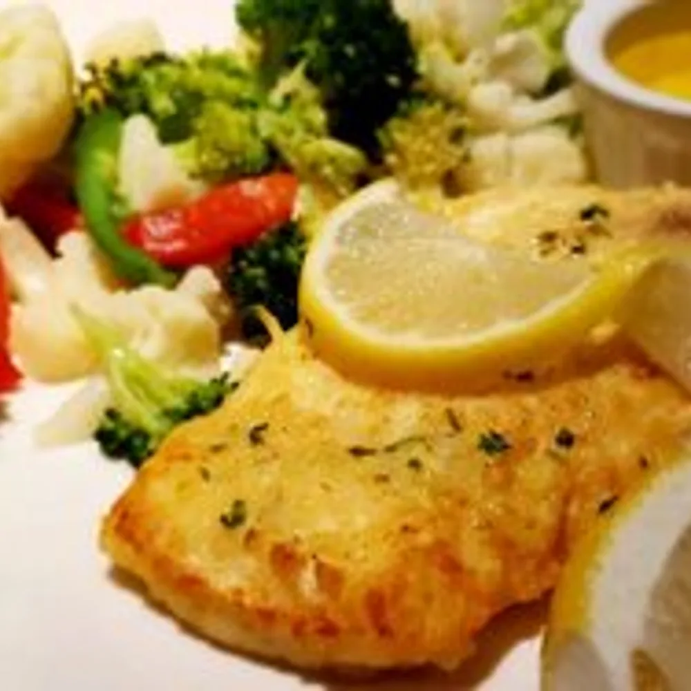 Grilled halibut with vegetables and lemon